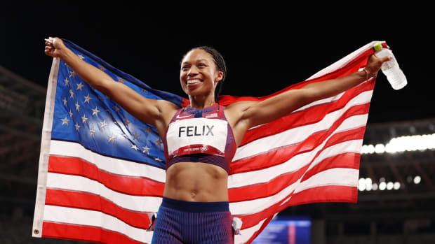 Allyson Felix celebrates her bronze medal.