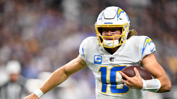 LAS VEGAS, NEVADA - JANUARY 09: Justin Herbert #10 of the Los Angeles Chargers rushes the ball during the second quarter against the Las Vegas Raiders at Allegiant Stadium on January 09, 2022 in Las Vegas, Nevada. (Photo by Chris Unger/Getty Images)